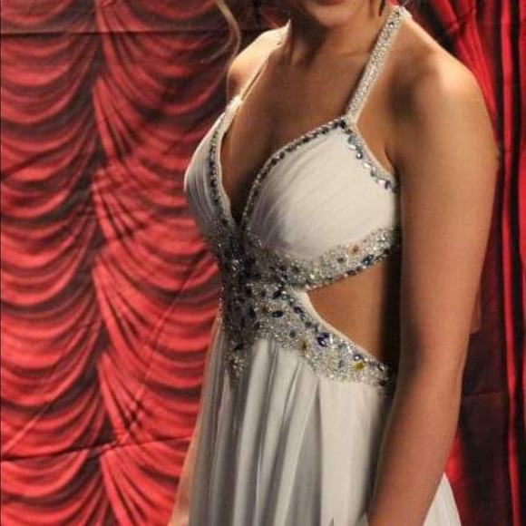 A Jasz Couture Beautiful white with blue florals formal dress with cut outs. - Picture 9 of 10